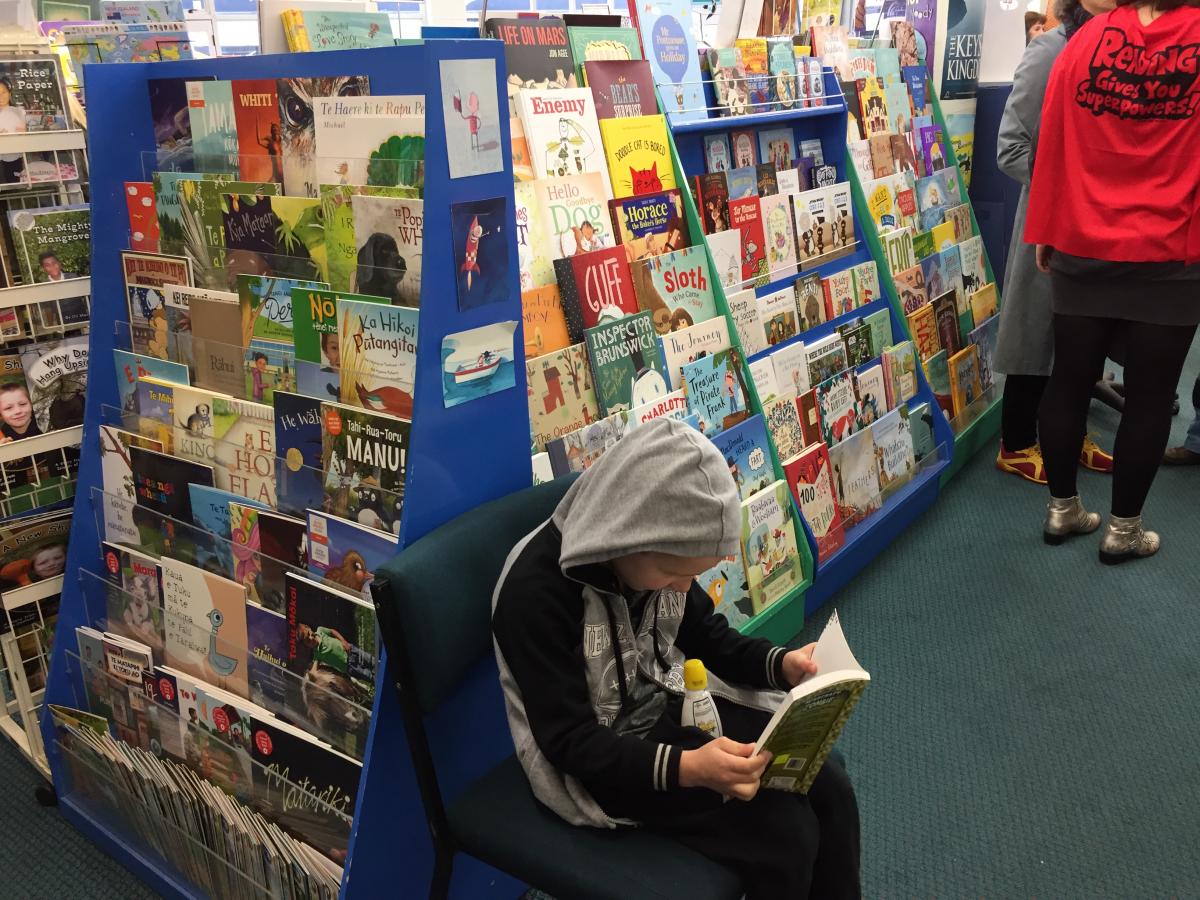 children's bookshop with young reader